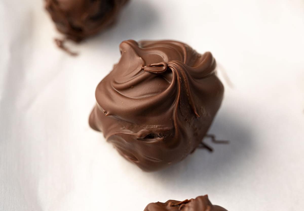 Close-up of an oreo ball on parchment paper