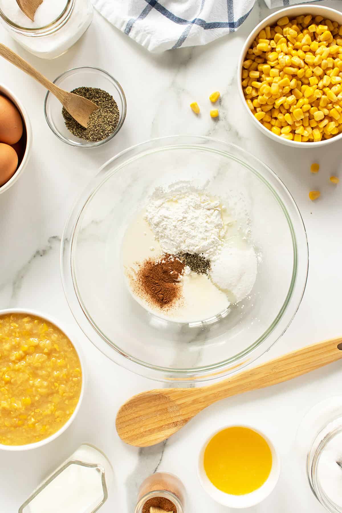 creamy corn pudding dry ingredients in clear mixing bowl