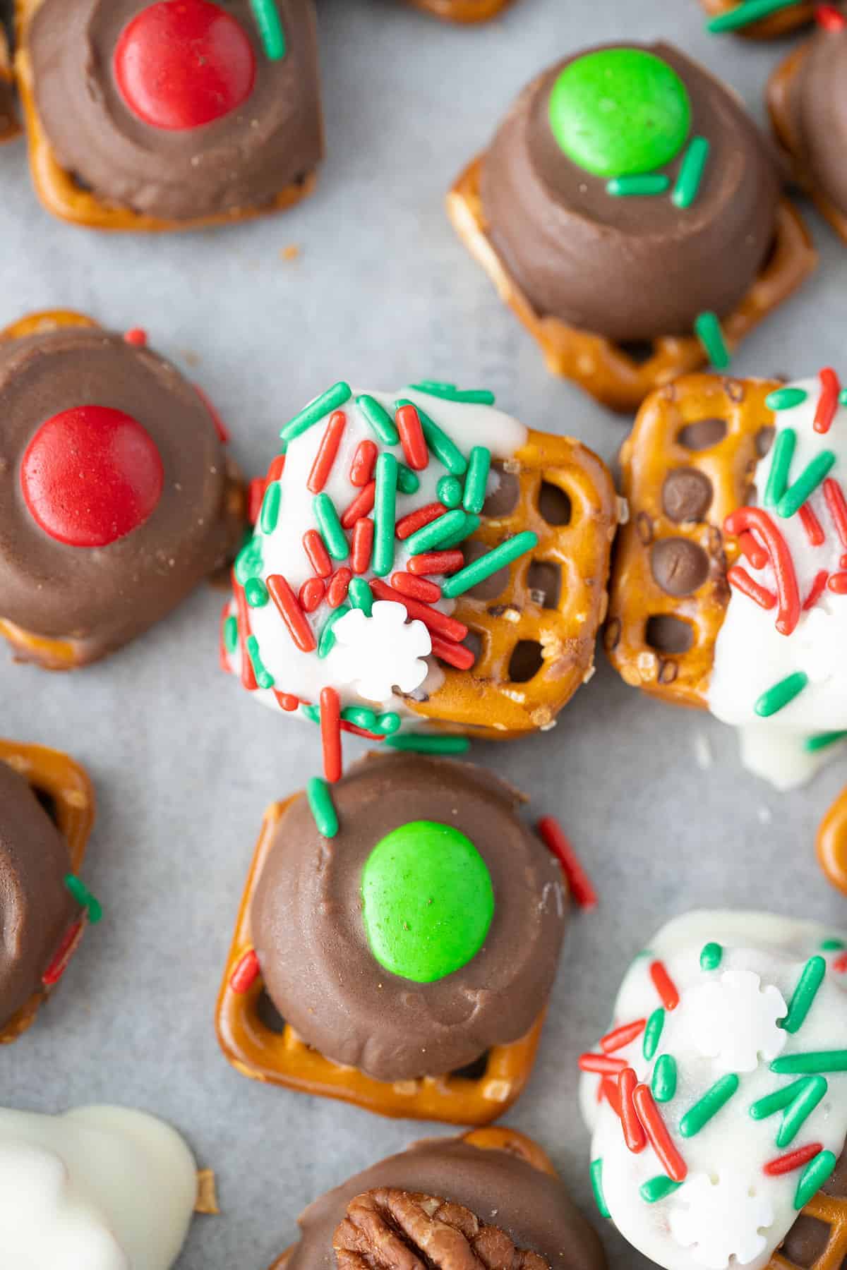 Close up of a few rolo pretzel bites, decorated different ways. 