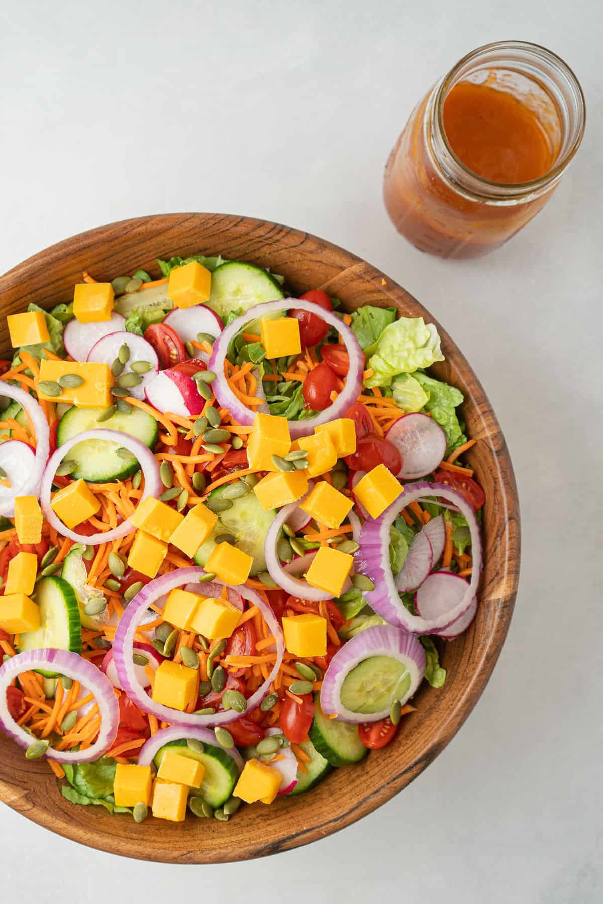 Tossed Salad in a wooden bowl with French dressing