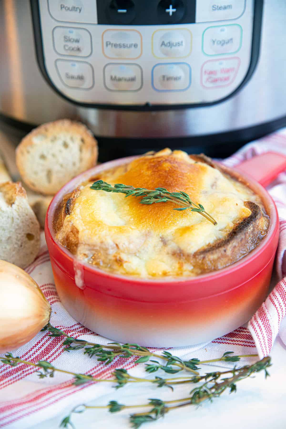 French onion soup in a red bowl 