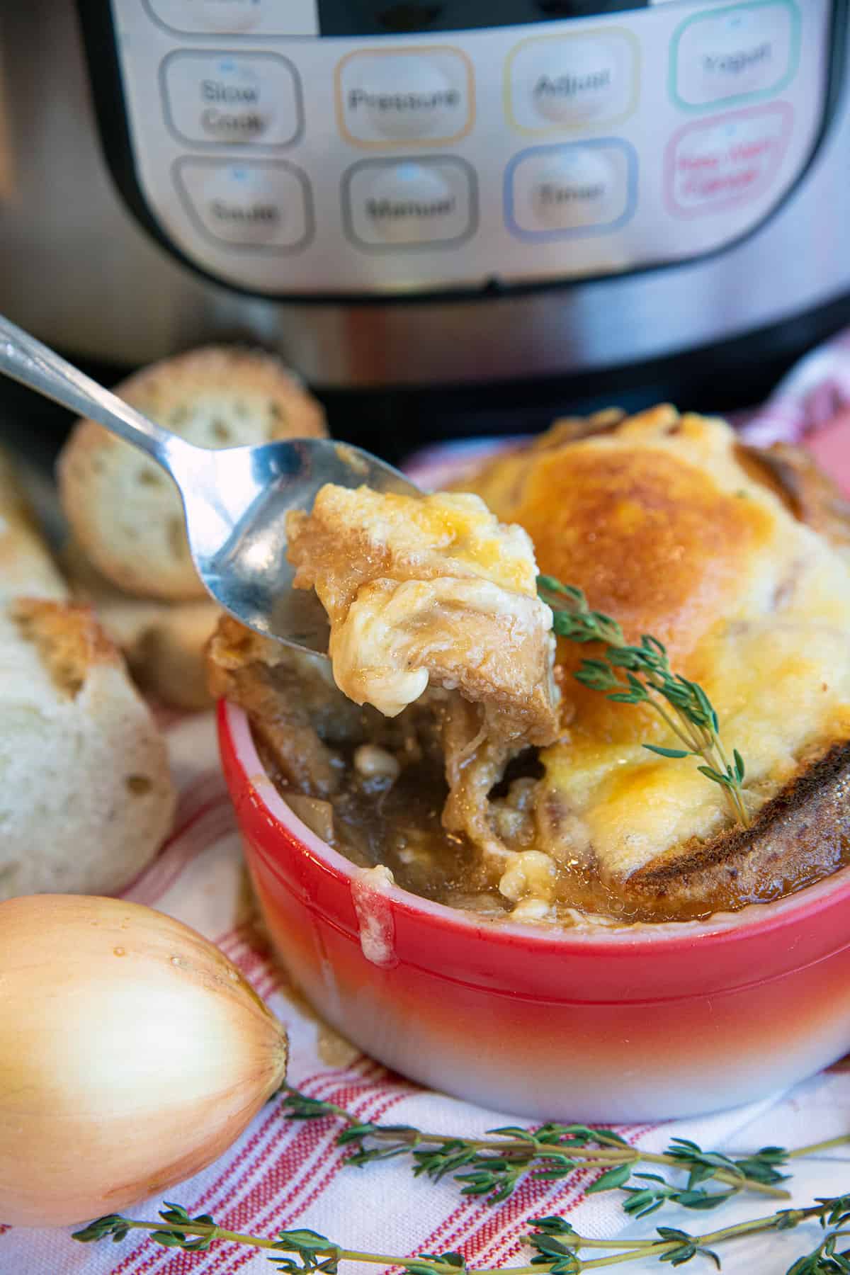 French onion soup in a red bowl 