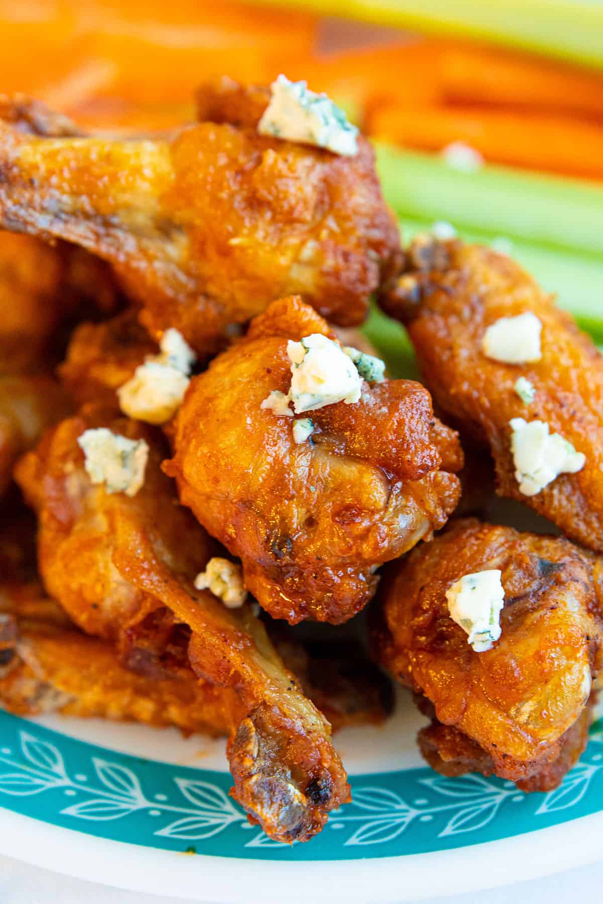 Buffalo wings covered in blue cheese crumbles