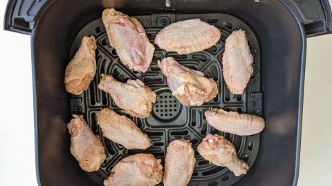 Chicken wings evenly spaced in the air fryer
