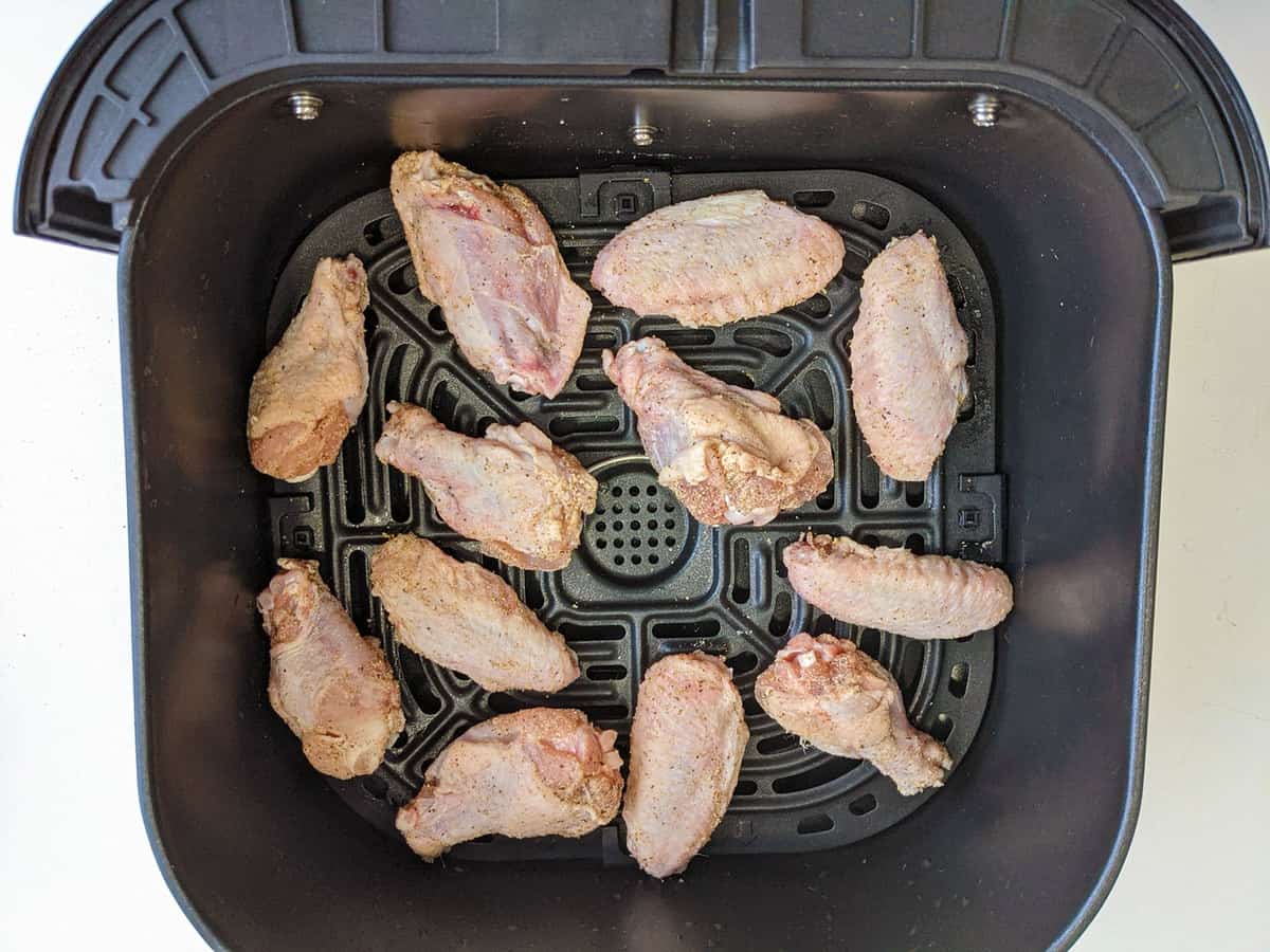 Chicken wings evenly spaced in the air fryer