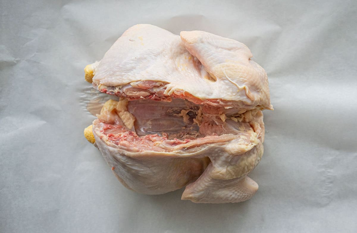 A chicken with its spine removed, showing the empty cavity. 