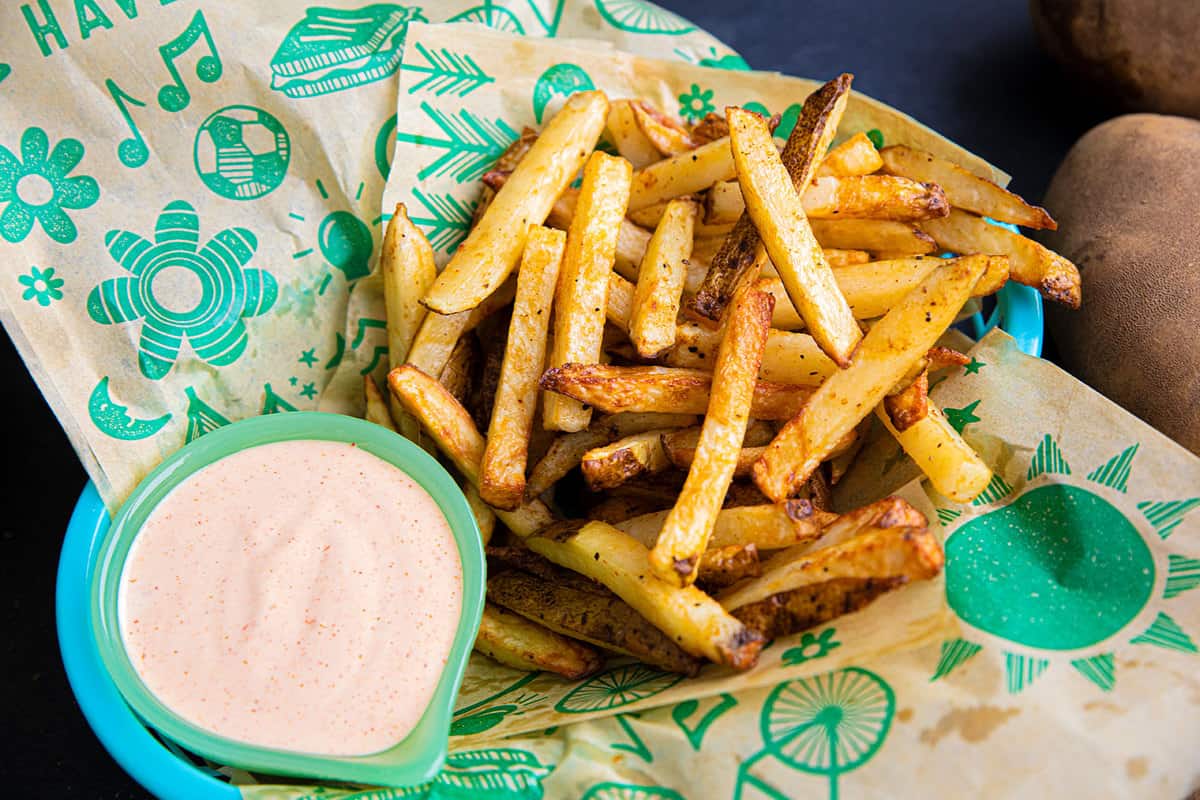 Air Fryer French Fries in a basket with a side of homemade fry sauce.