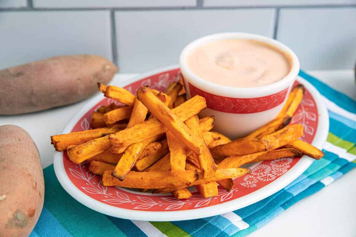 Air Fryer Sweet Potato Fries on a plate with dipping sauce