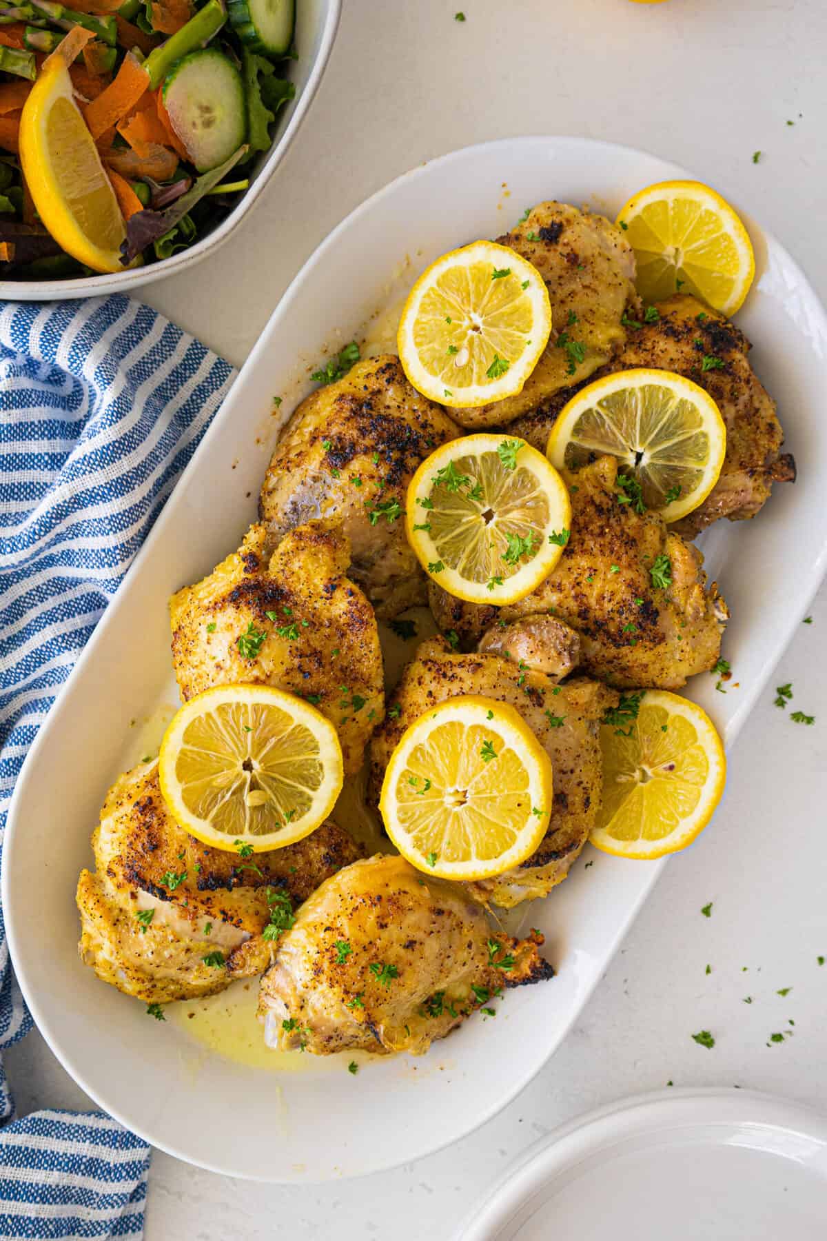 plate full of cooked lemon pepper chicken