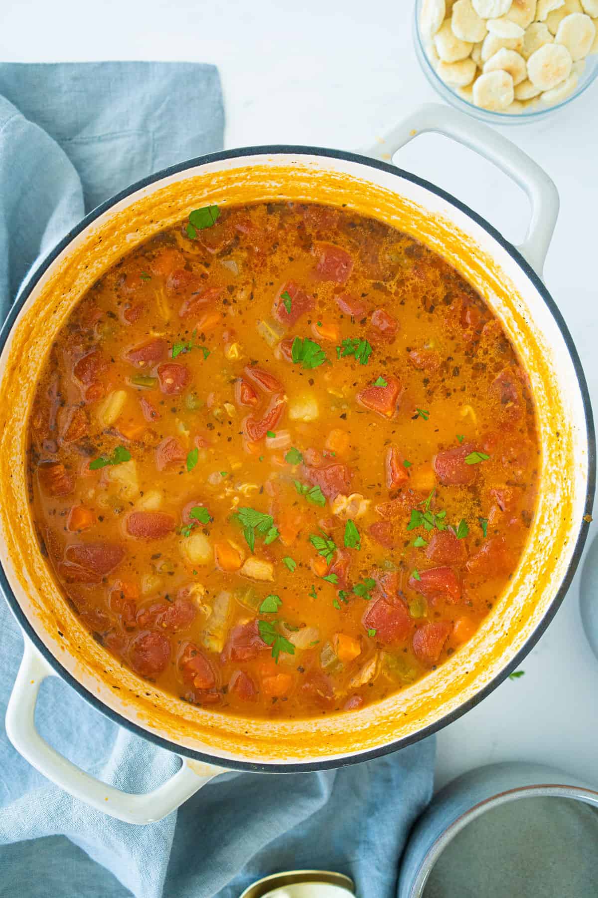 Manhattan Clam Chowder in a white Dutch oven