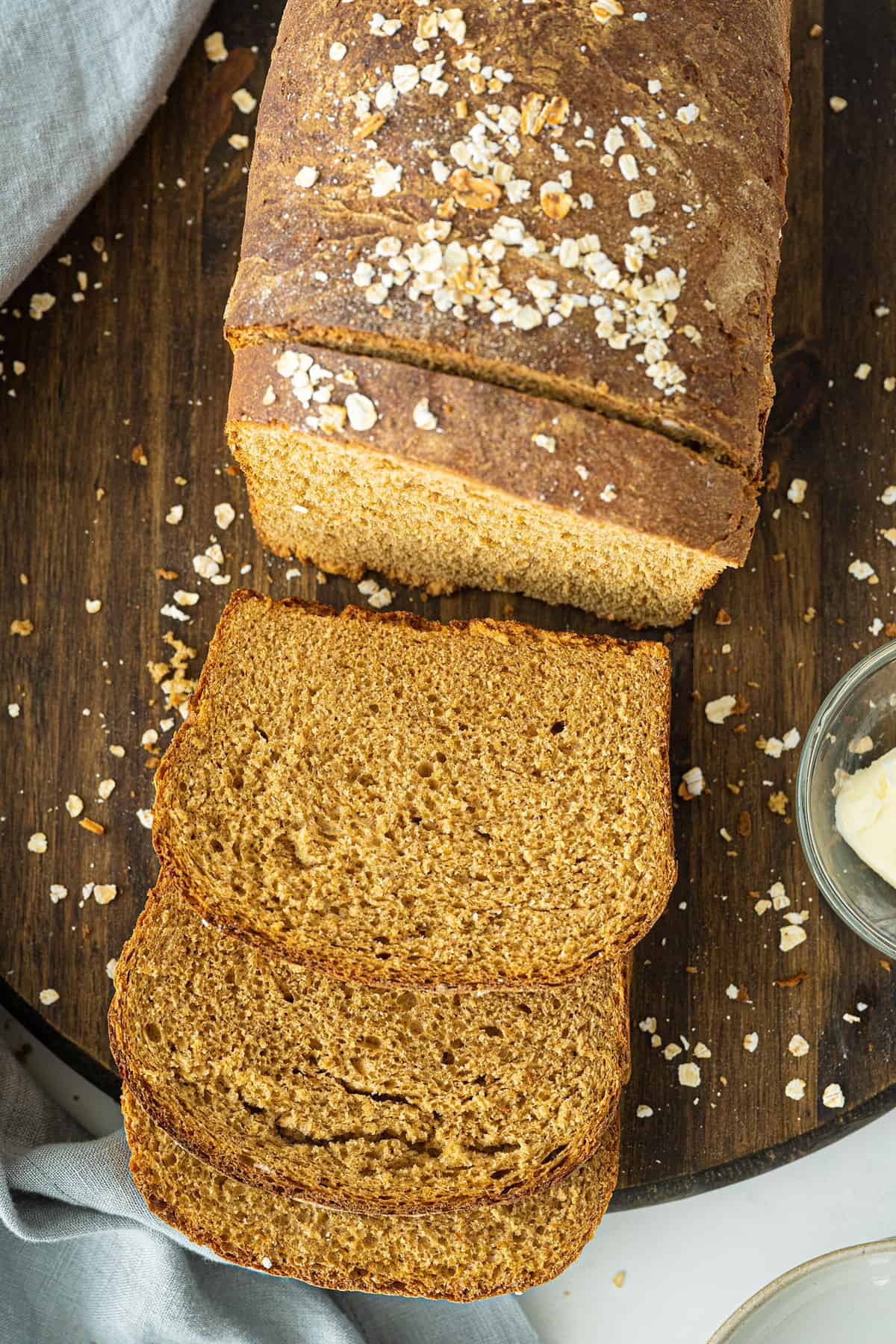 Oatmeal Bread sliced on a wooden cutting board