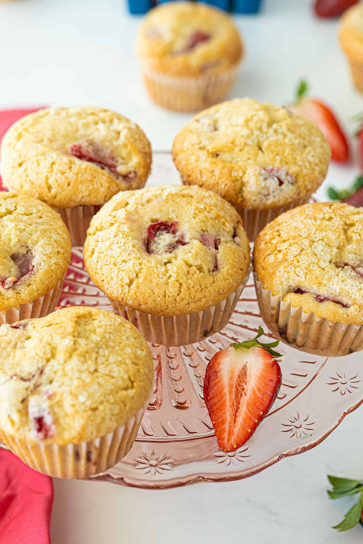 strawberry muffins on a pink platter