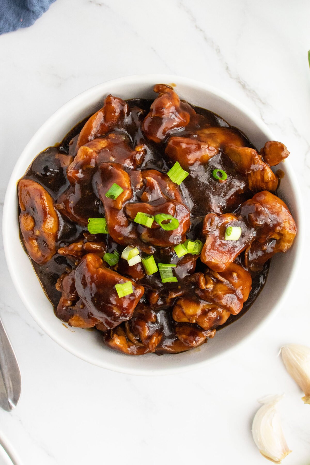 bourbon chicken in a white bowl