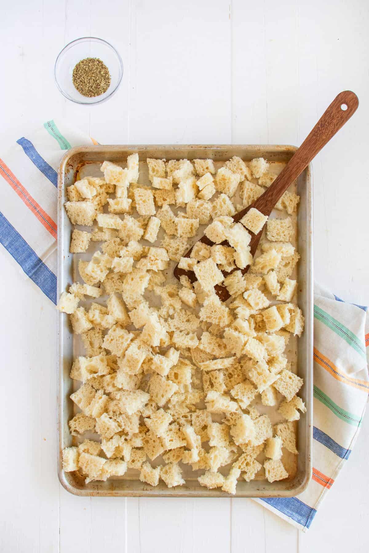 bread cubes on a baking tray