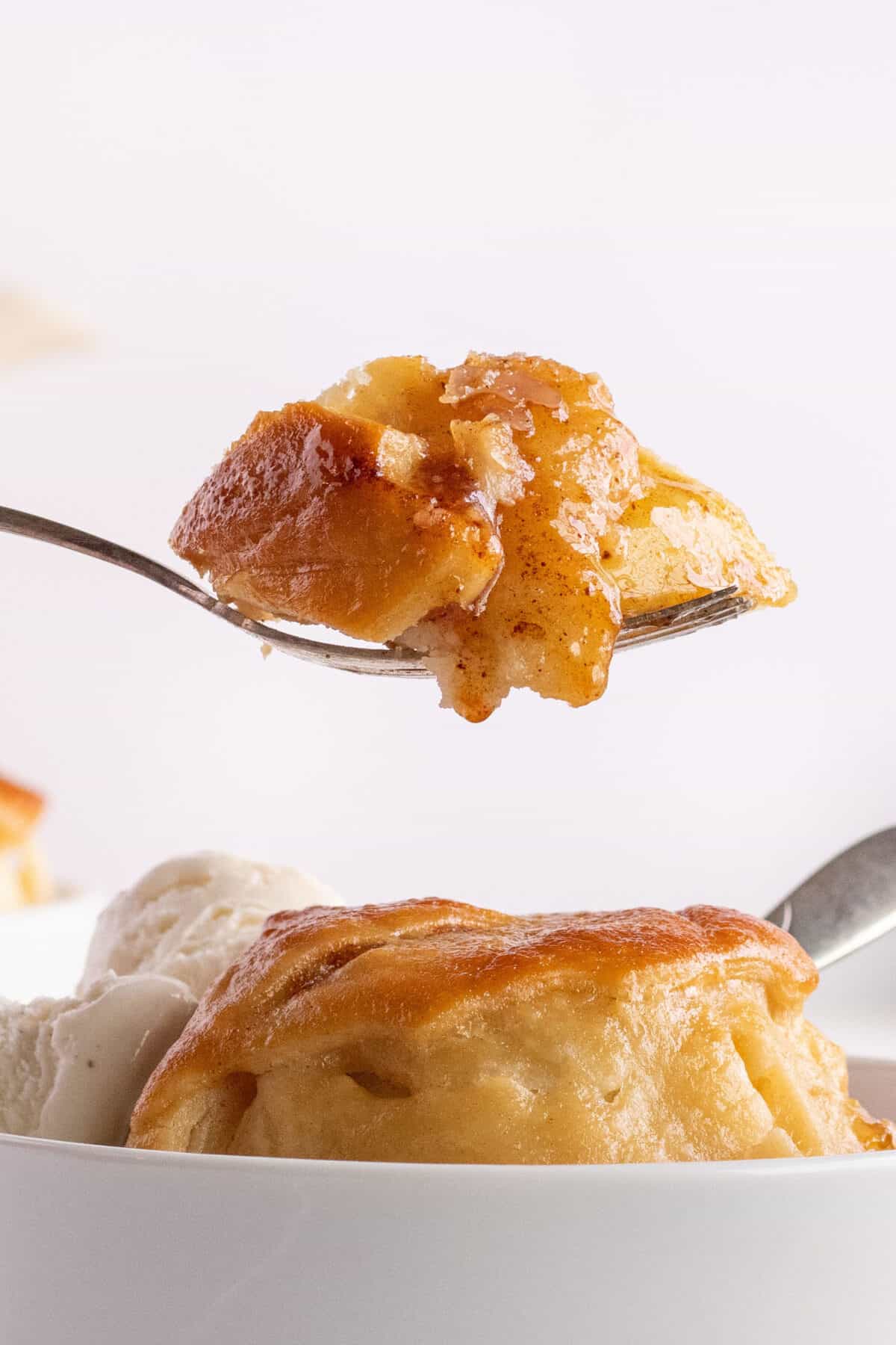 a scoop of apple dumpling on a spoon