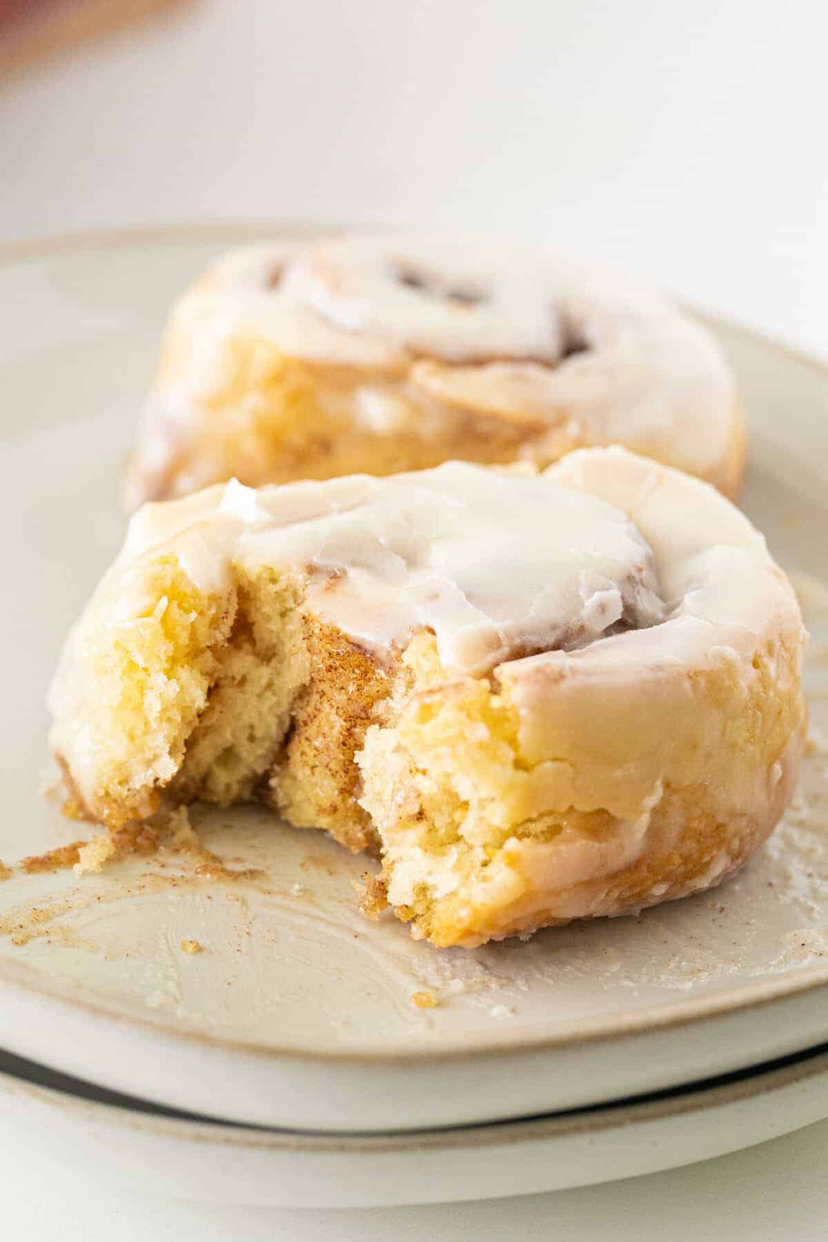 cinnamon roll with a bite taken out of it.