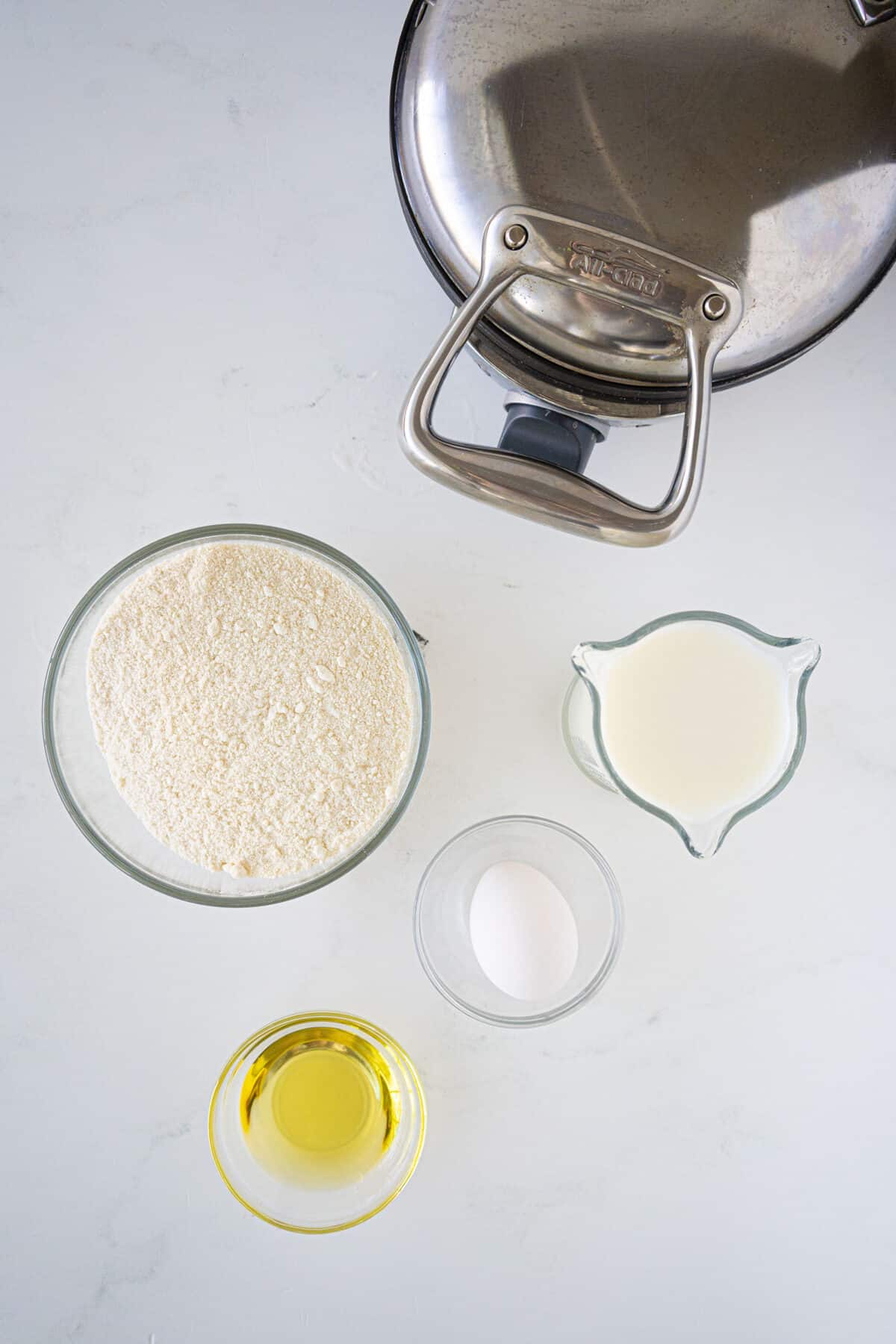 bisquick waffle ingredients on a white table.