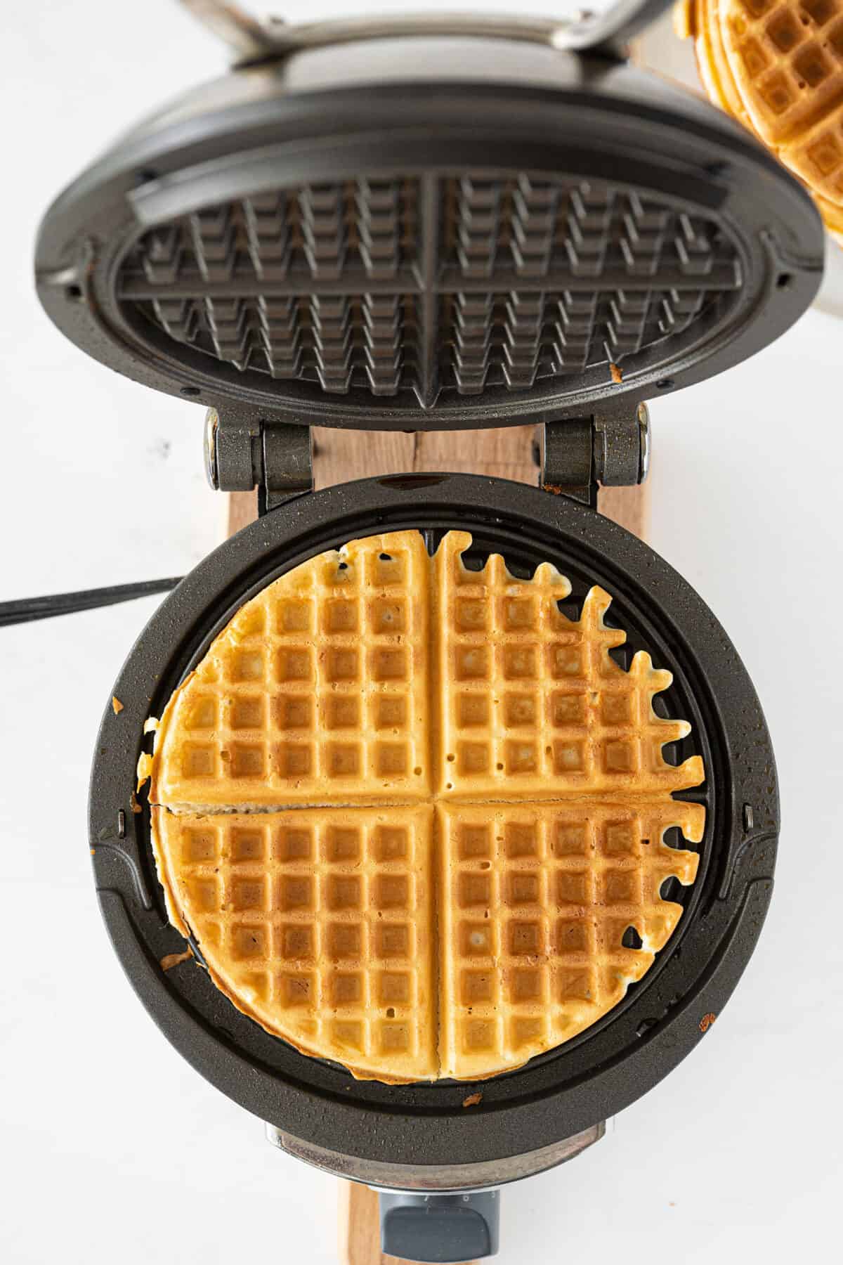 bisquick waffles being prepared in a waffle maker