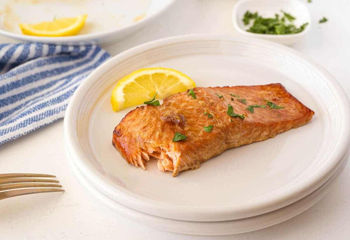 cooked salmon on a white plate
