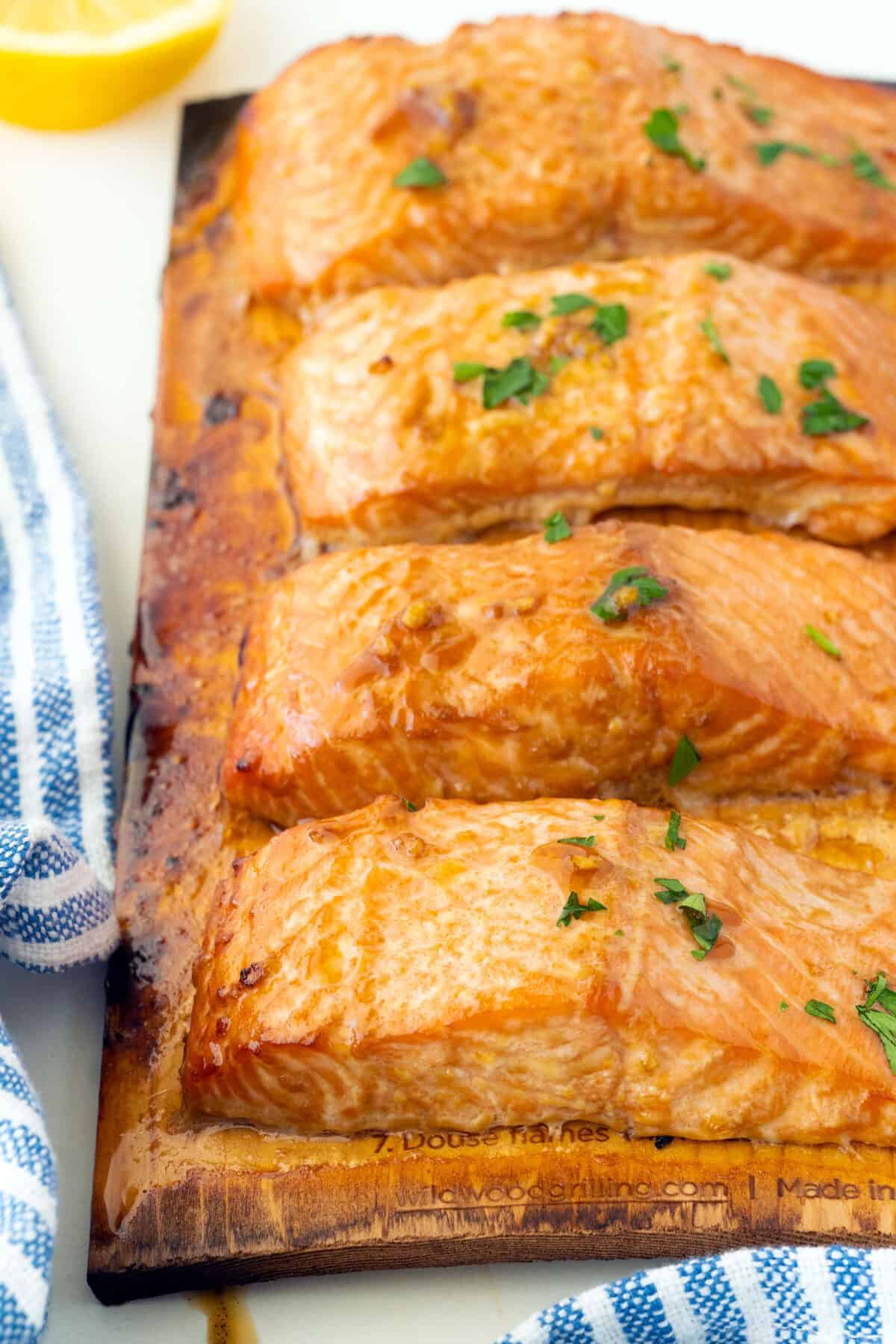 cooked salmon on a cedar board