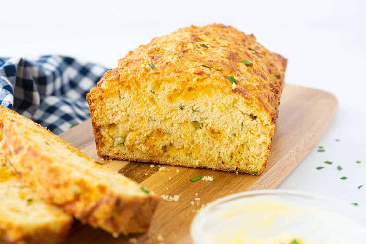 sliced cheese bread on a wooden board 