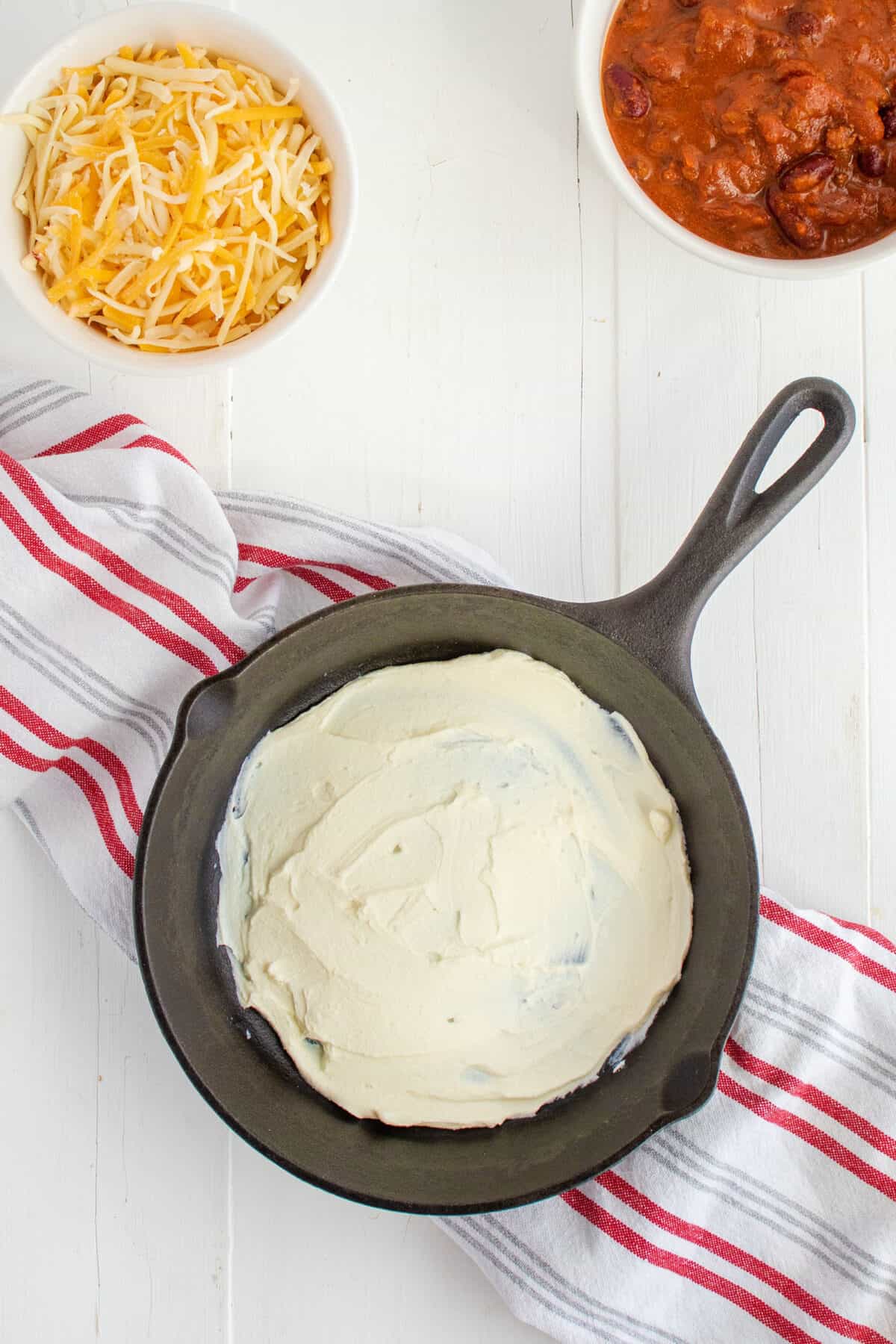 cream cheese in bottom of cast iron pan