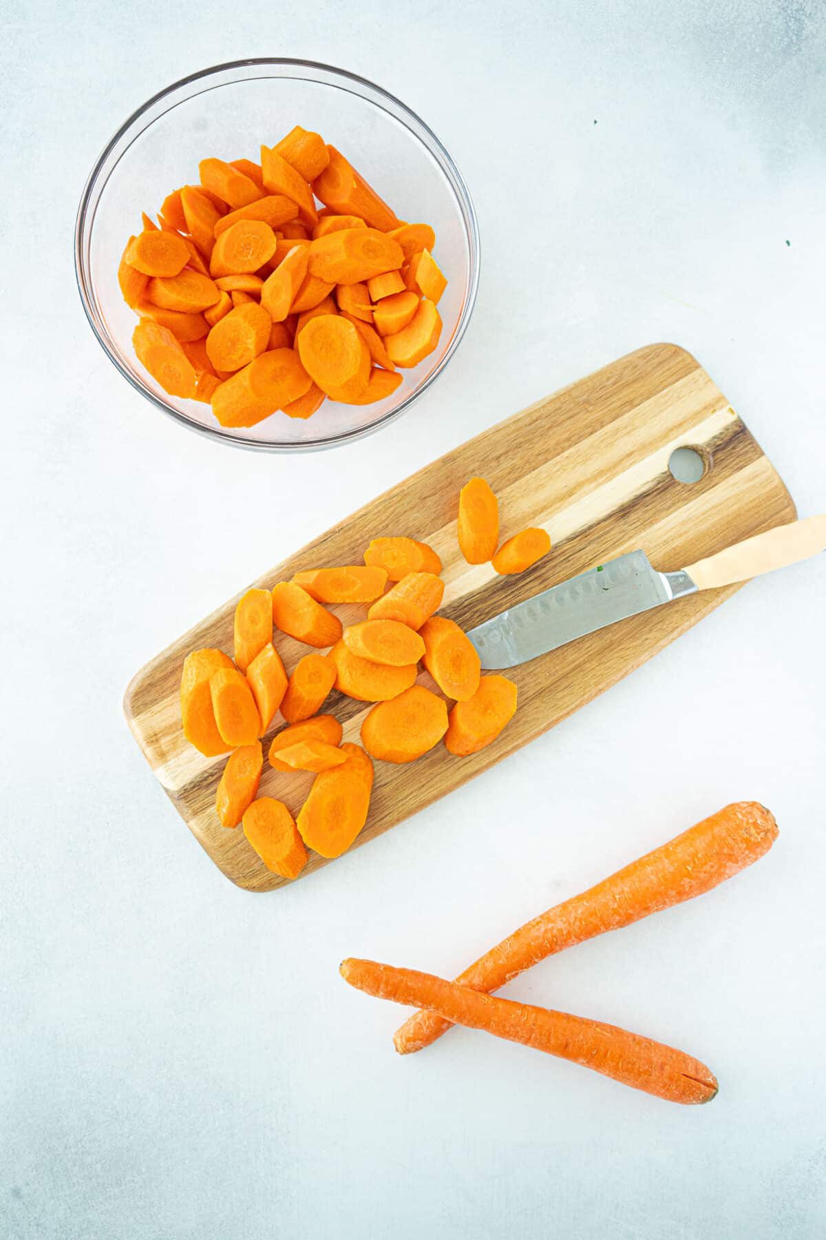 picture of cutting carrots on a cutting board