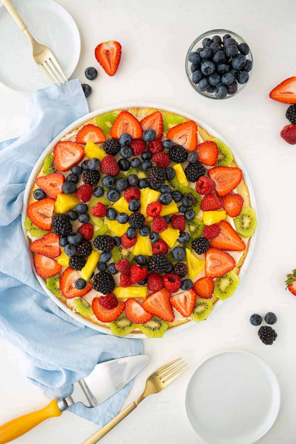 top down shot of a complete fruit pizza