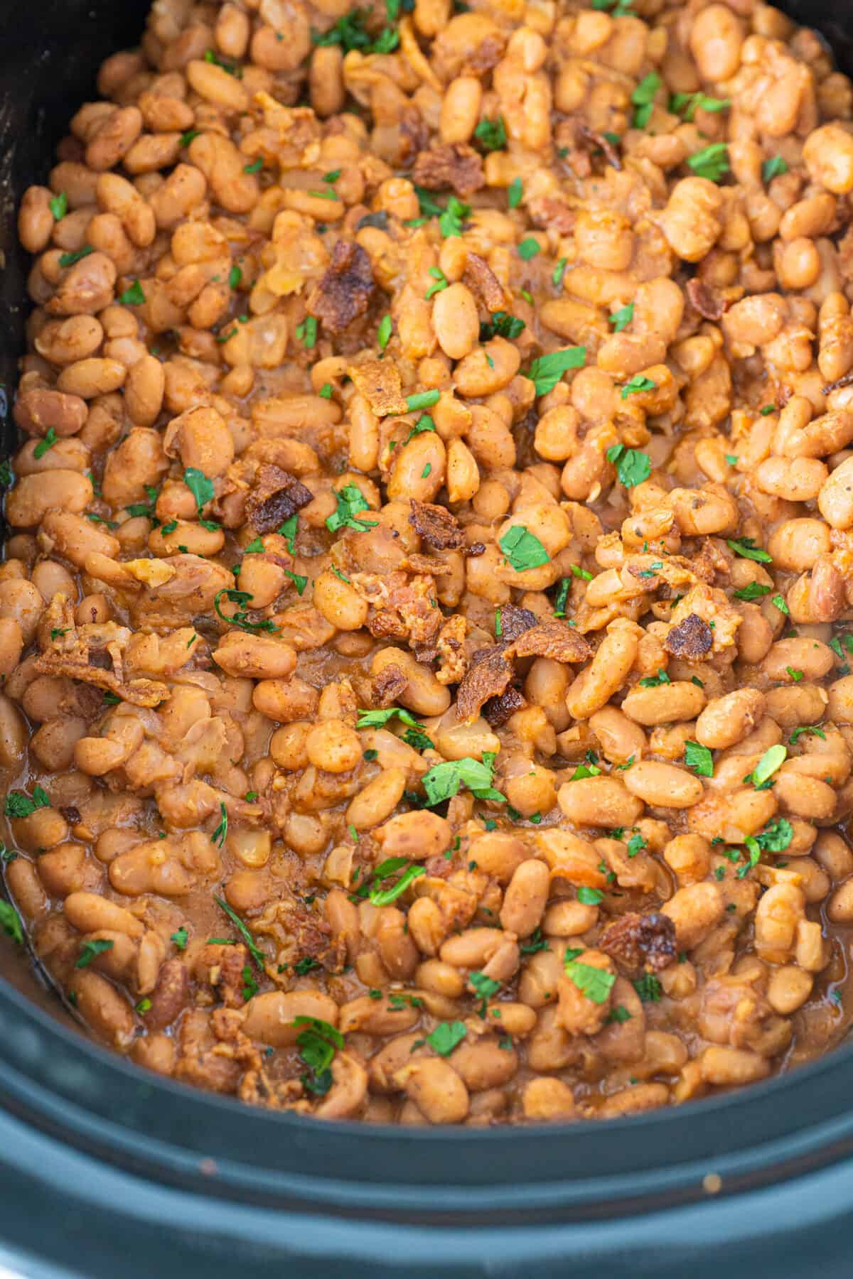 Ranch style beans in a black slow cooker