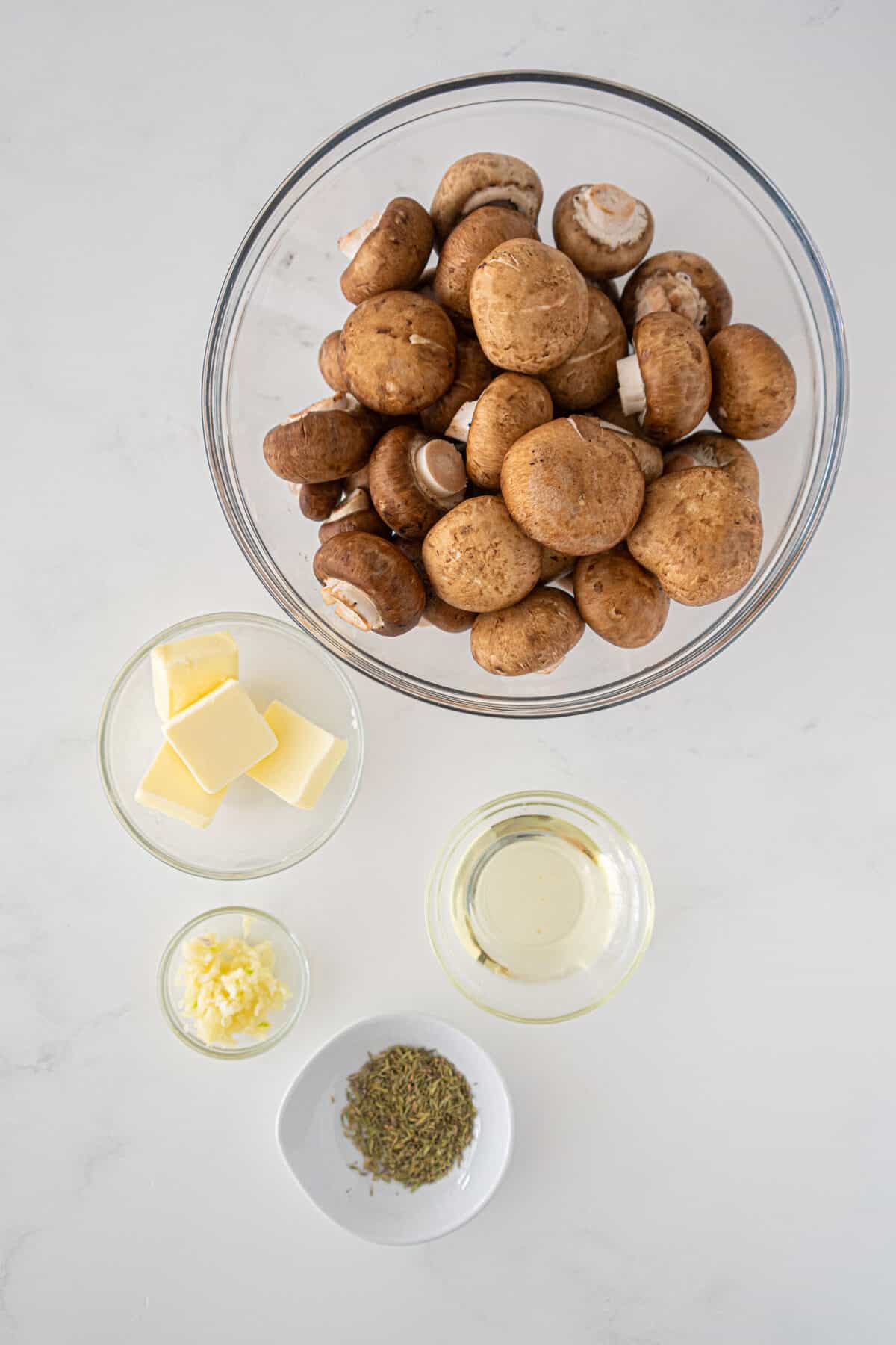 Ingredients for butter garlic and thyme roasted mushrooms