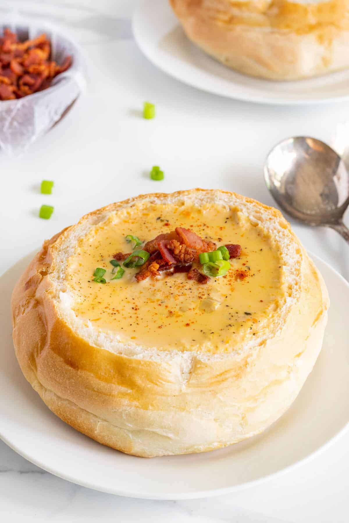 close up of beer cheese soup in a bread bowl 