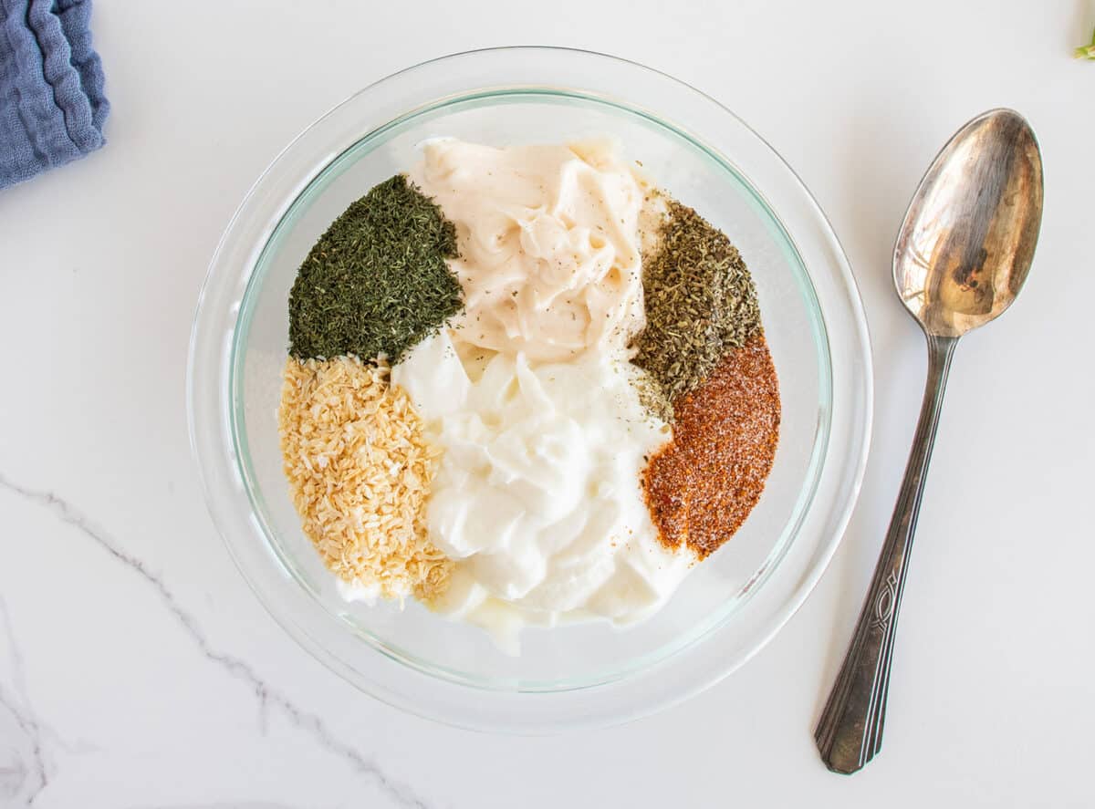 dill dip ingredients in a clear bowl