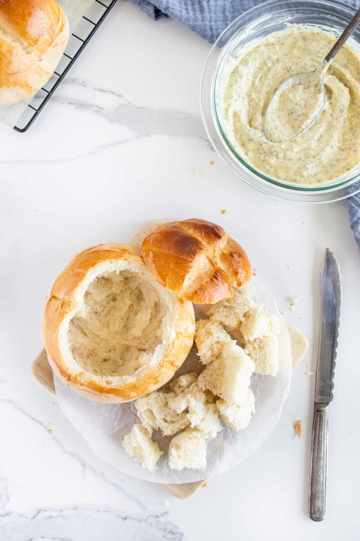 hollowing out a bread bowl for dill dip