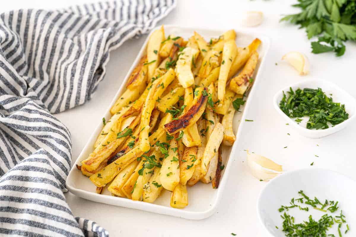 roasted parsnips on a white plate