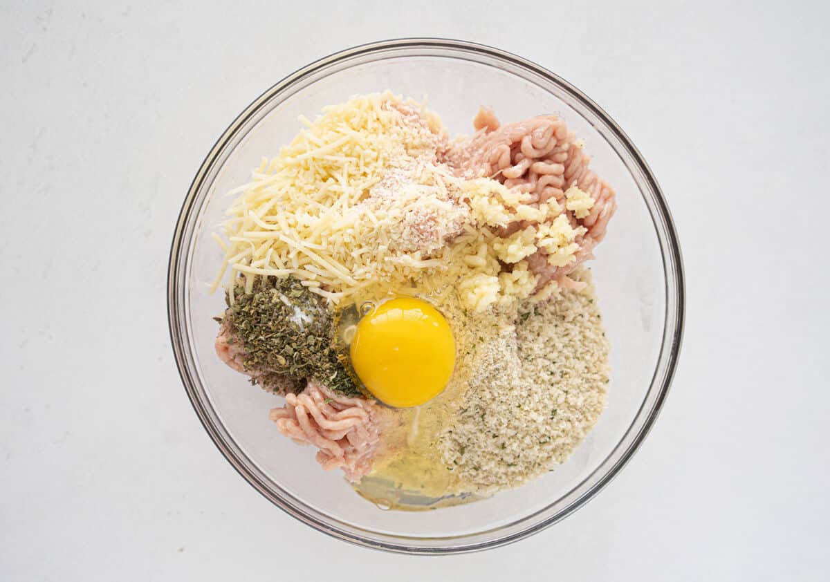 baked chicken meatball ingredients in a glass bowl