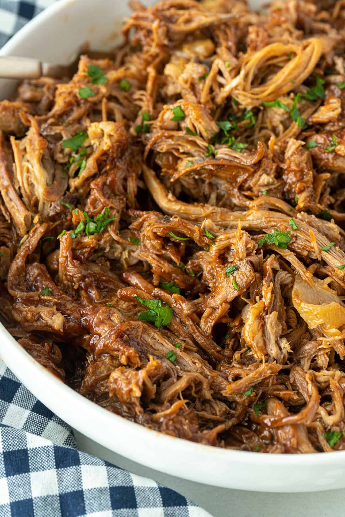 root beer pulled pork in a white bowl