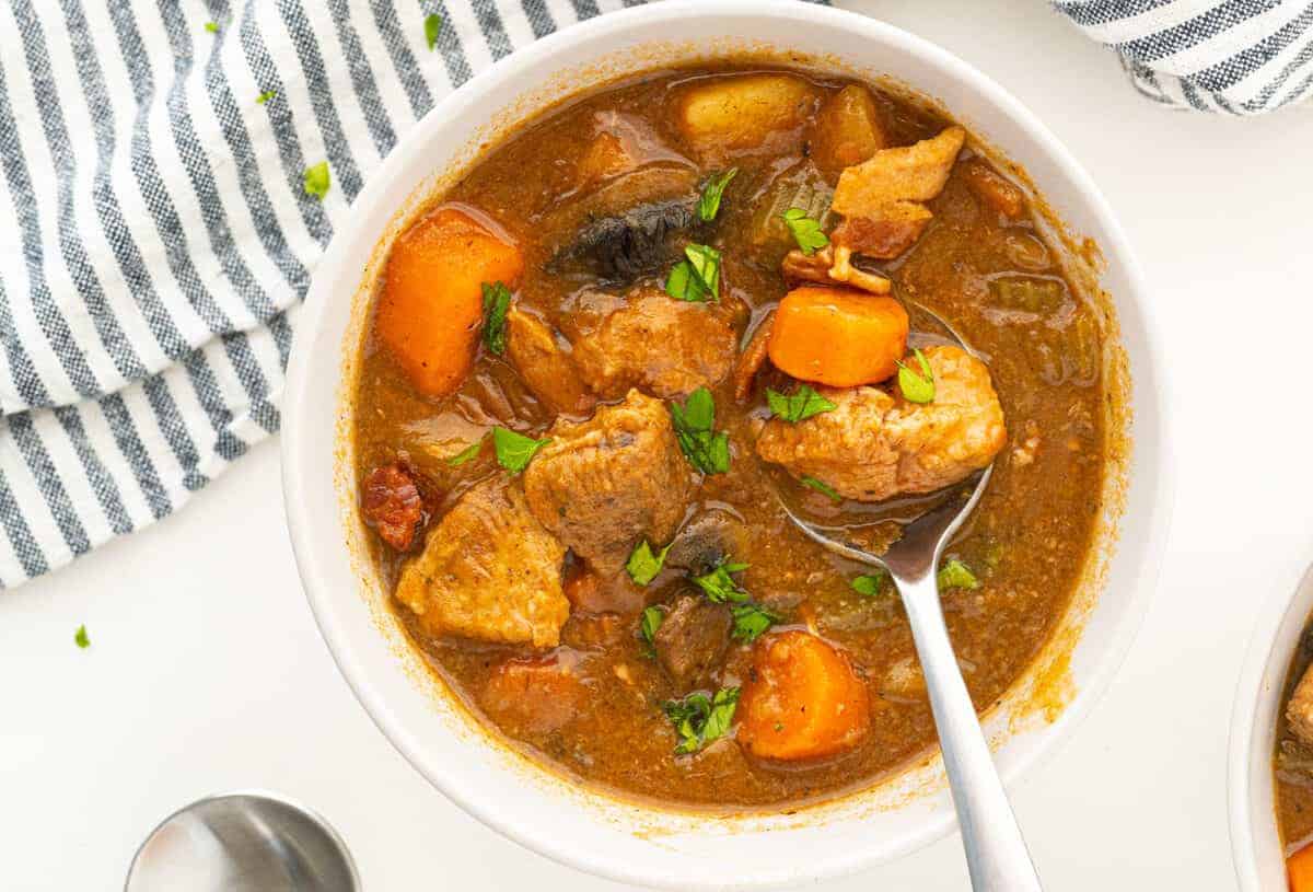 pork stew in a white bowl