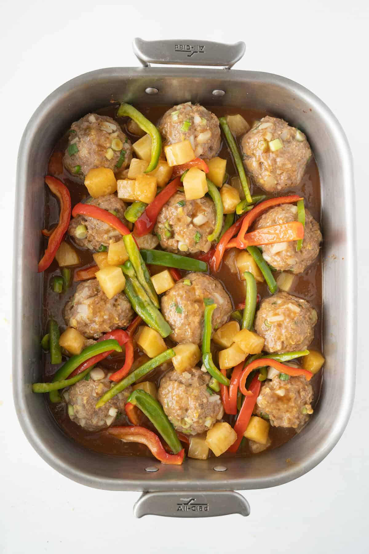 sweet and sour pork meatballs with vegetables ready to cook