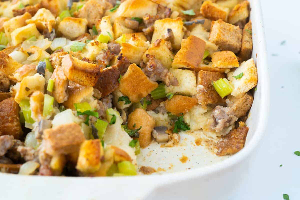 baked sausage stuffing in a white pan