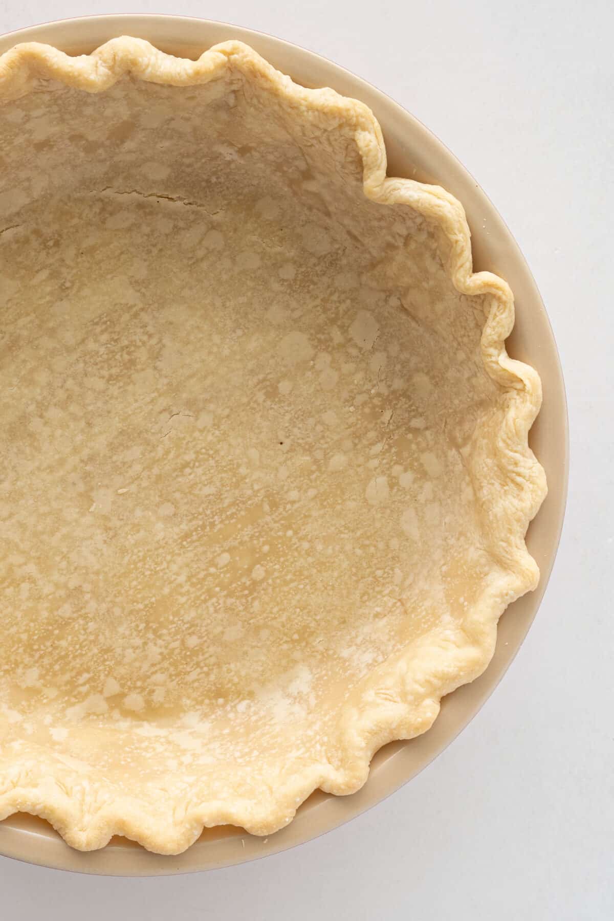 blind baked pie crust in a pie plate 