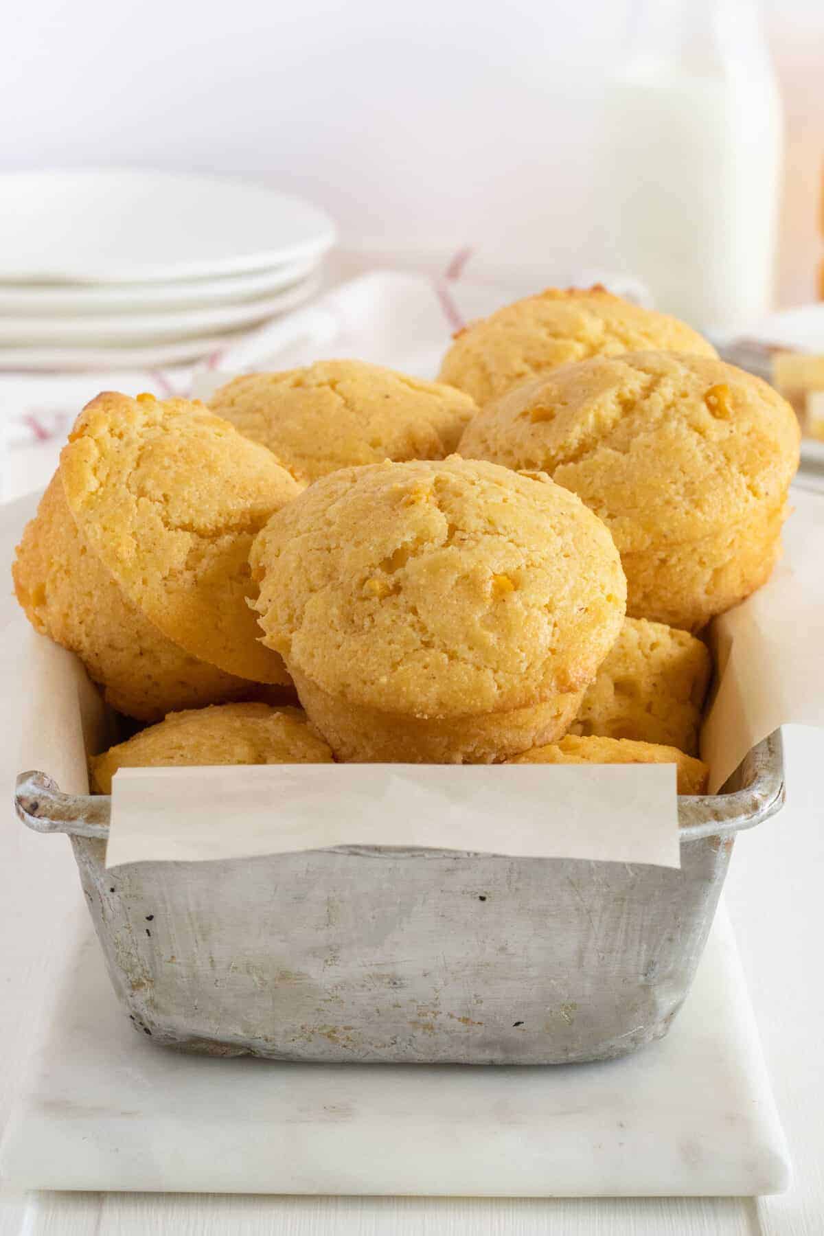 stack of cornbread muffins in a baking pan