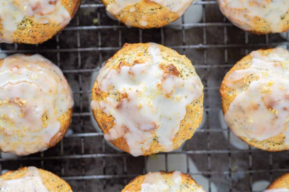 lemon poppy seed muffins on a wire baking rack