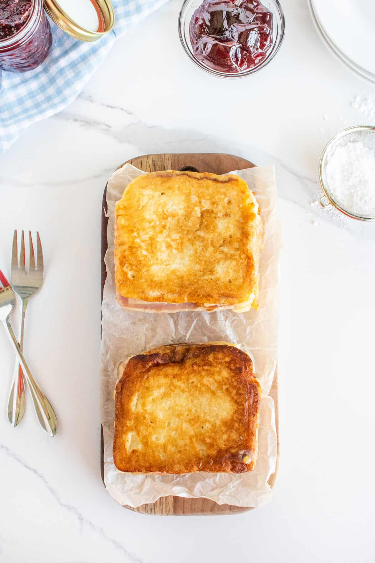 Monte Cristo sandwiches on a wooden board