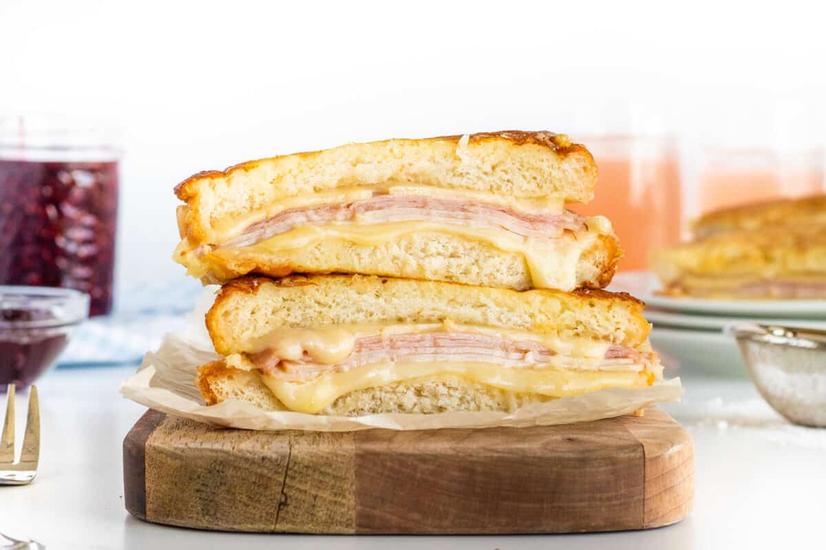 Monte Cristo sandwich stacked on a wooden board