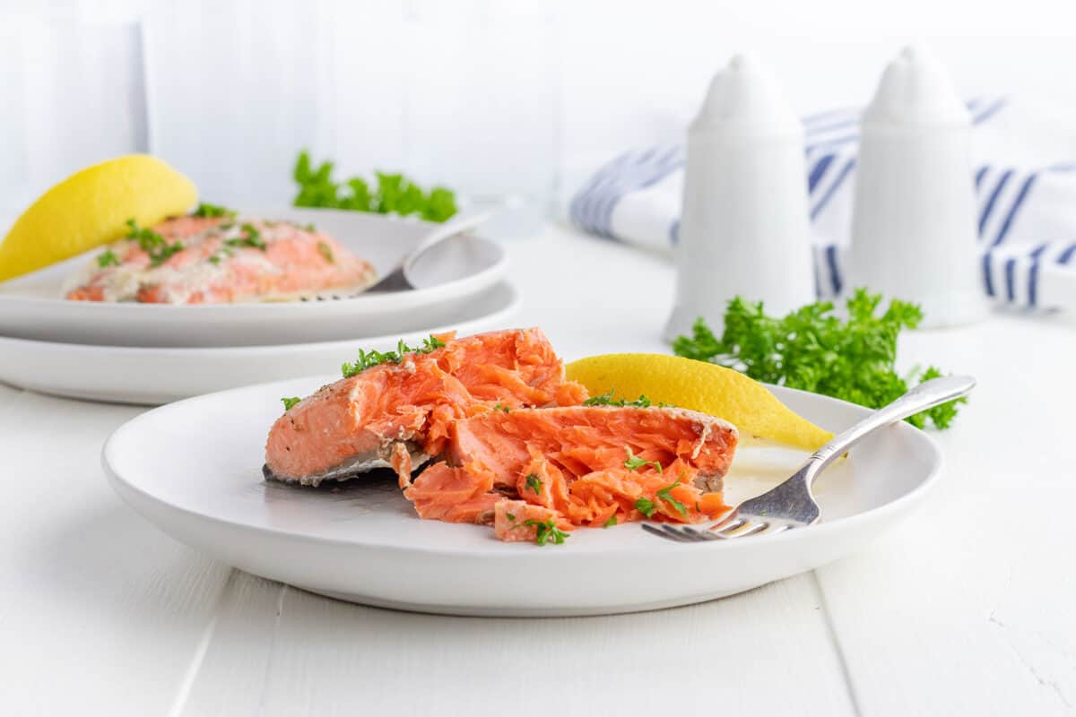 poached salmon on a white plate