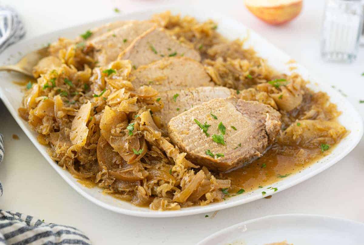 pork and sauerkraut on a white plate 
