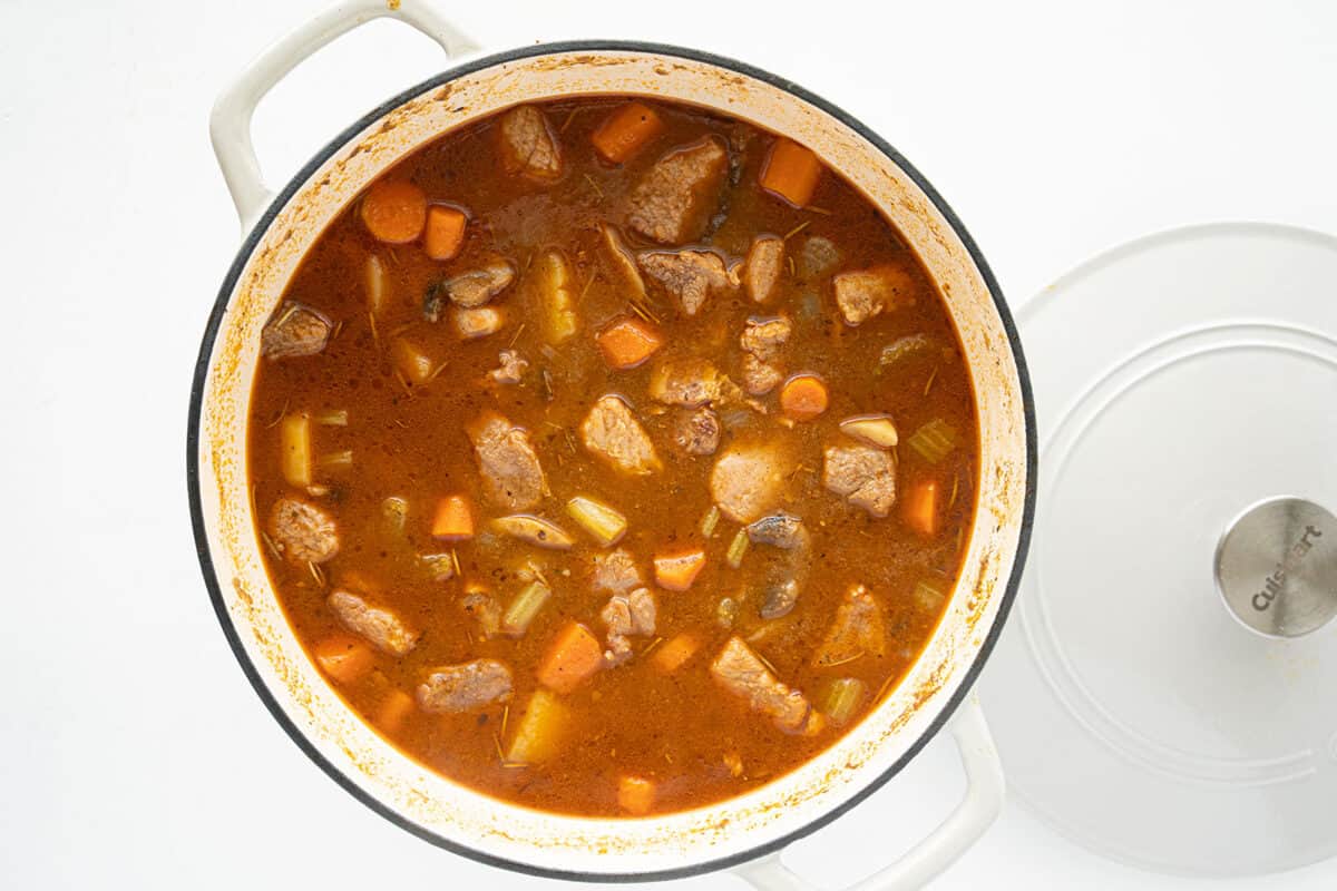 pork stew in a white Dutch oven