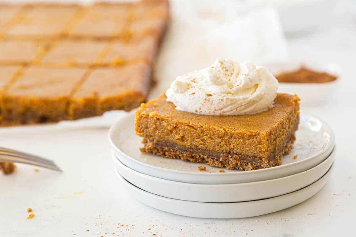 pumpkin pie bars on a white plate 