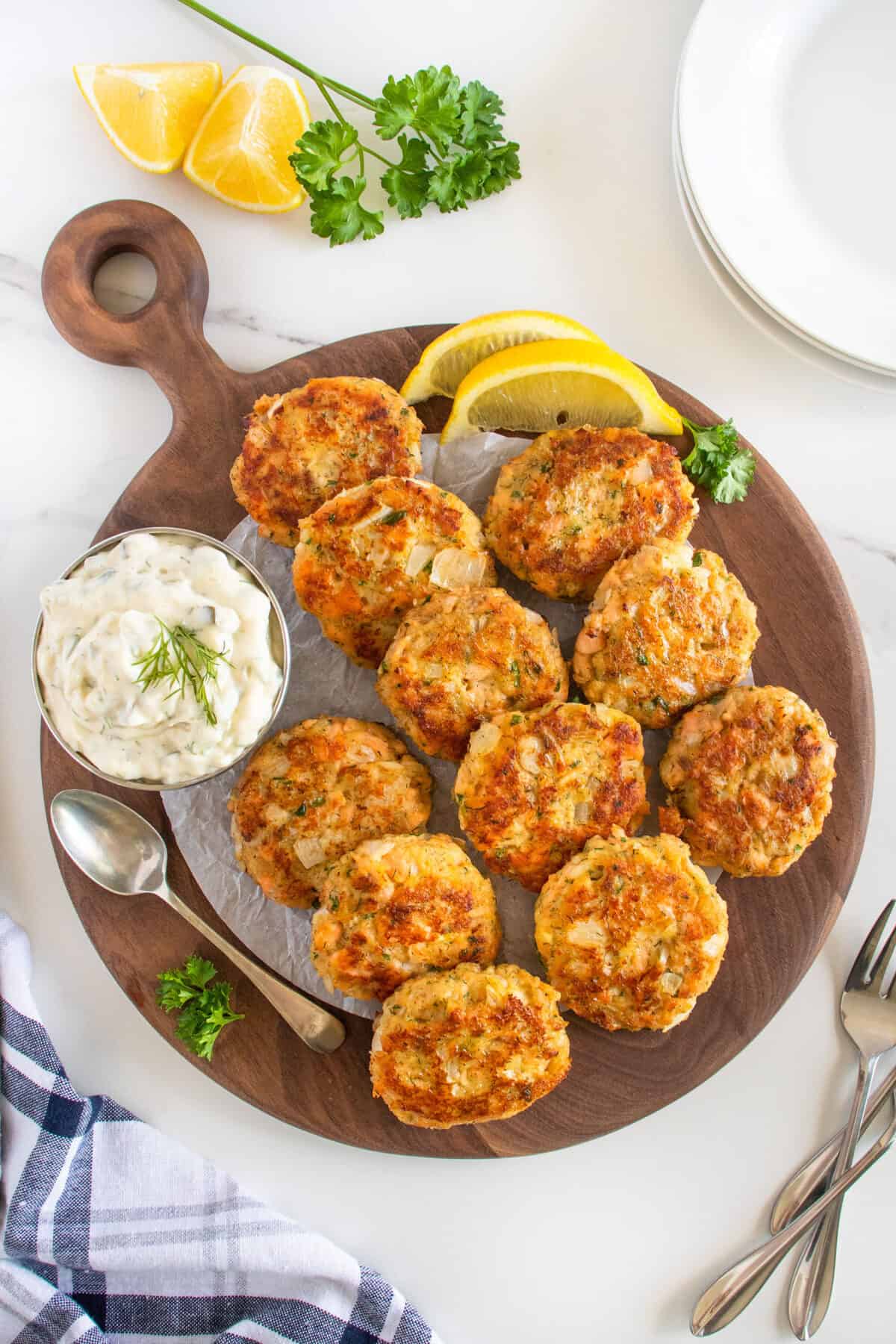 cooked salmon patties on a wooden board