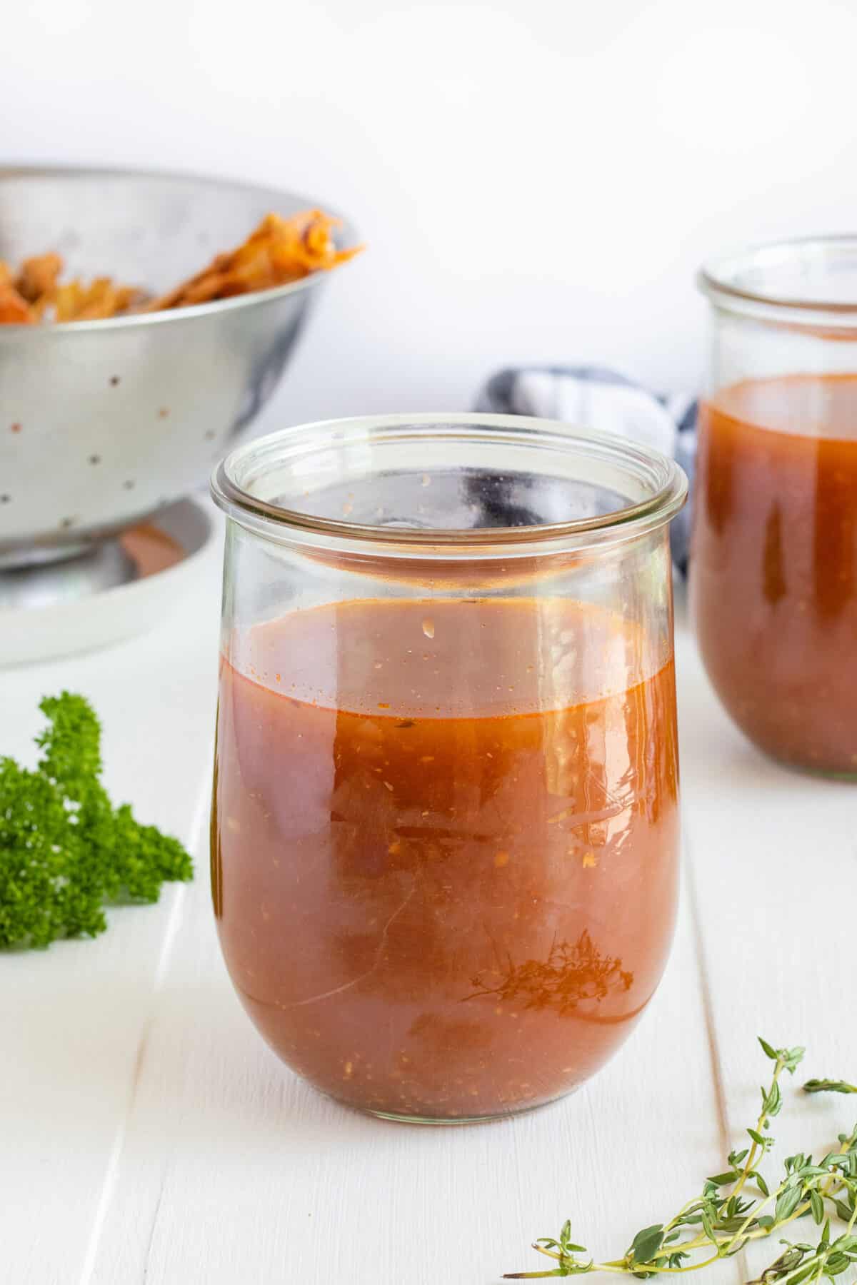 seafood stock in a glass jar